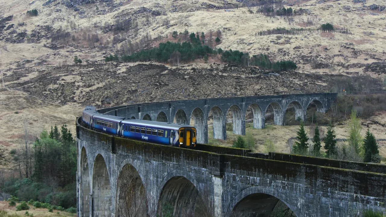 A ScotRail train curving across the Glenfinnan Viaduct on the West Highland Line